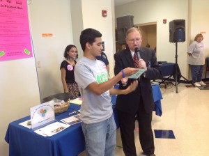 President Martinez and Dr. Oliver announce the winner