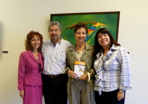 Carlos A. Camargo and teachers at SPC Seminole exhibit
