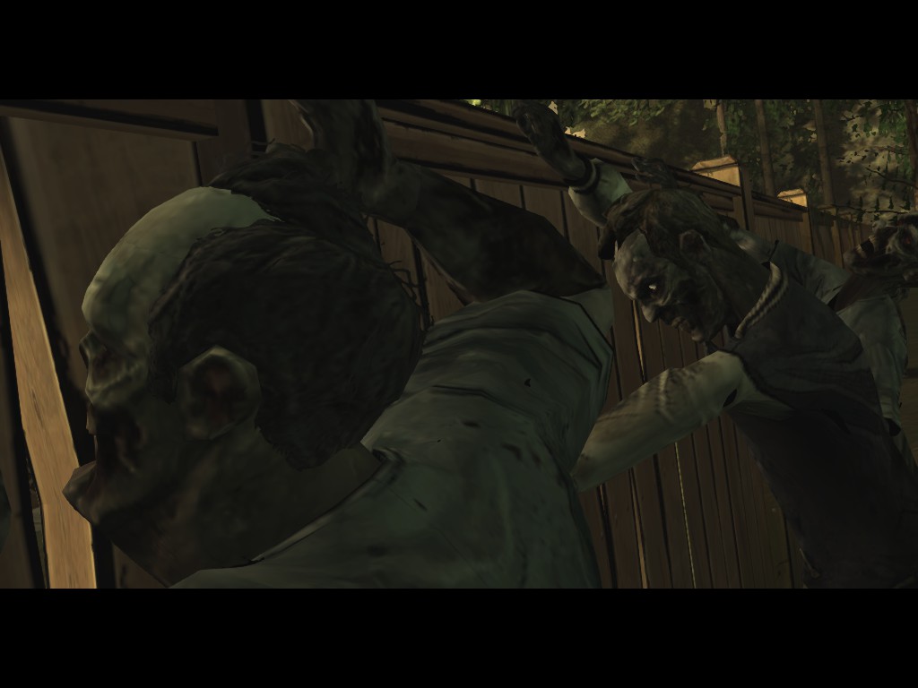 Zombies attacking a fence