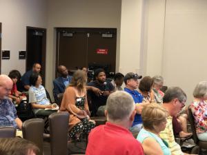 Audience member asking the panel a question