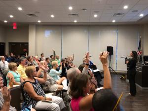 Audience members who have been affected by extreme weather, questioned by Dr. U